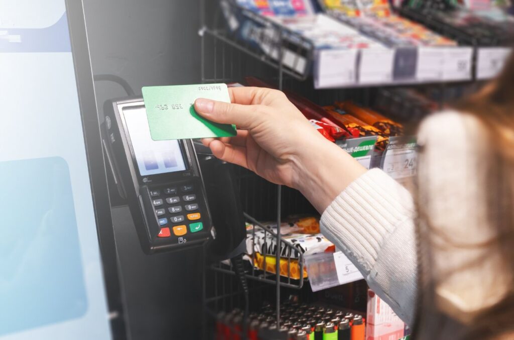 Person using card at vending machine