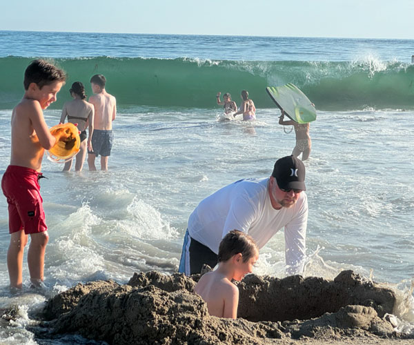 Family and people at the beach.