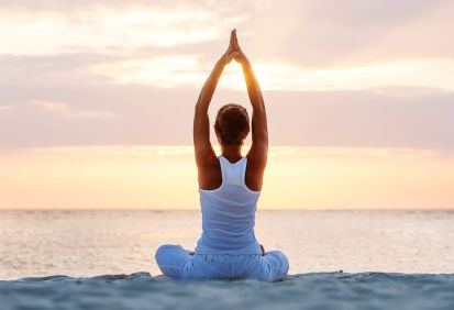Women doing yoga on the beach in Laguna.