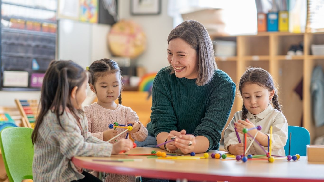 LBUSD Overview hero image of school kids and a teacher.