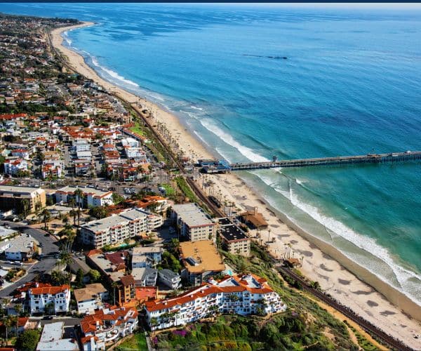 San Clemente pier and beach with surfers in South Orange County